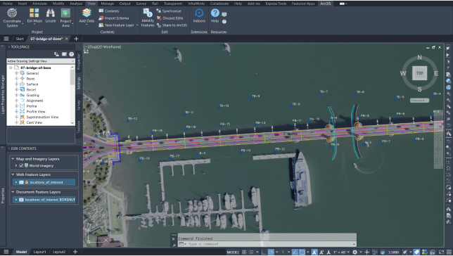 A bridge spanning water with boats and land and numerical data representing a CAD drawing in ArcGIS for AutoCAD 