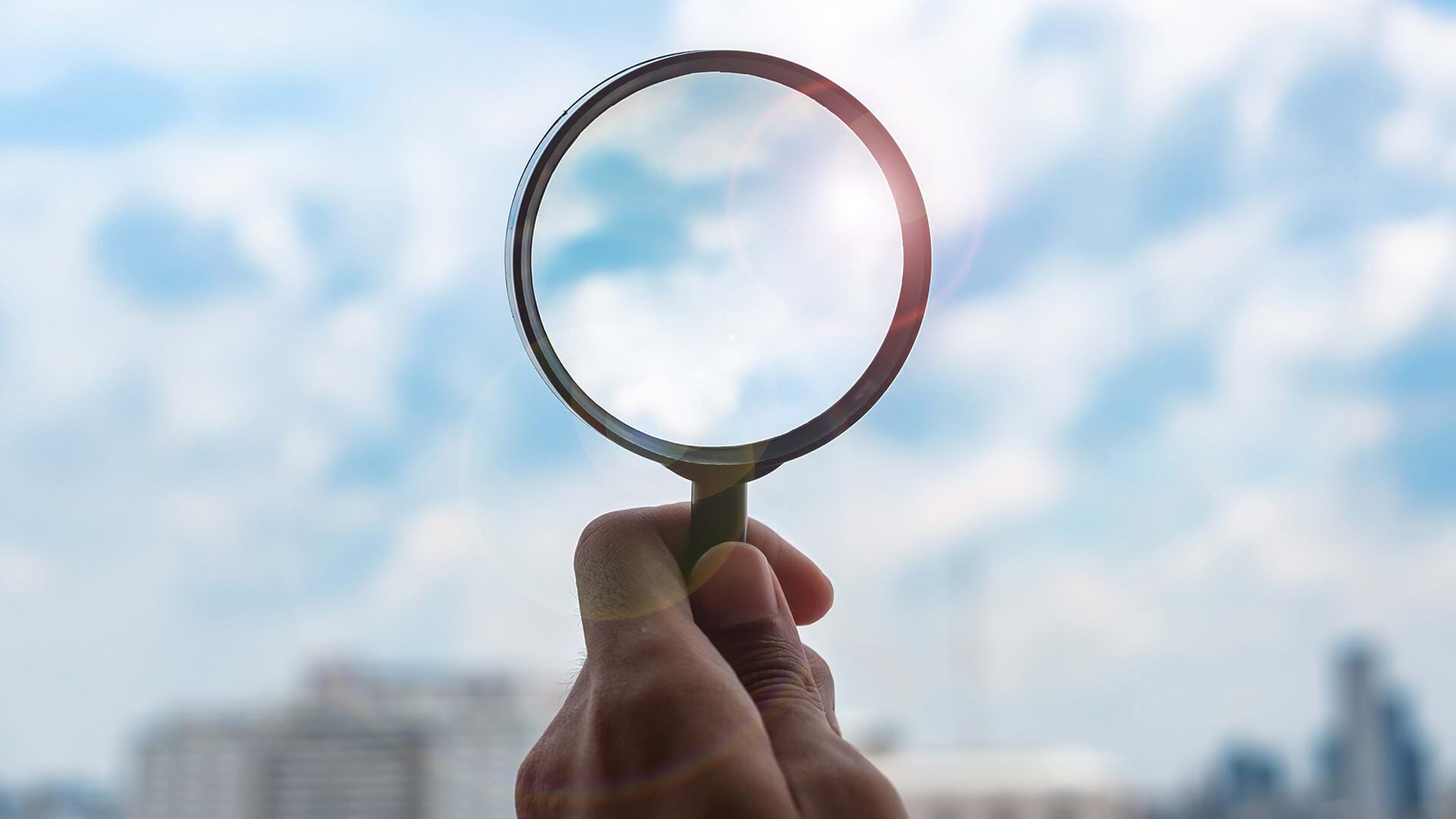 A magnifying glass held to the sky represents corporate climate disclosure