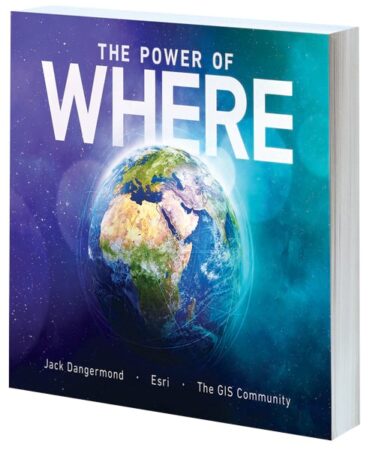 A blue book cover reads The Power of Where: A Geographic Approach to the World’s Greatest Challenges.