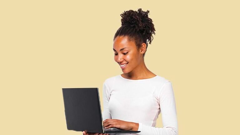 A woman using a laptop who represents the Professional user type