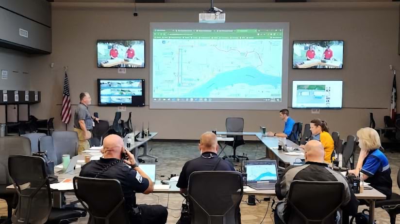 Scott County emergency management officials work in an emergency operations center