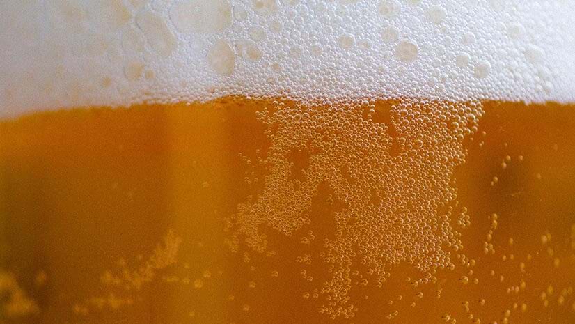 A closeup of a beer--nonalcoholic or alcoholic; it\'s hard to say