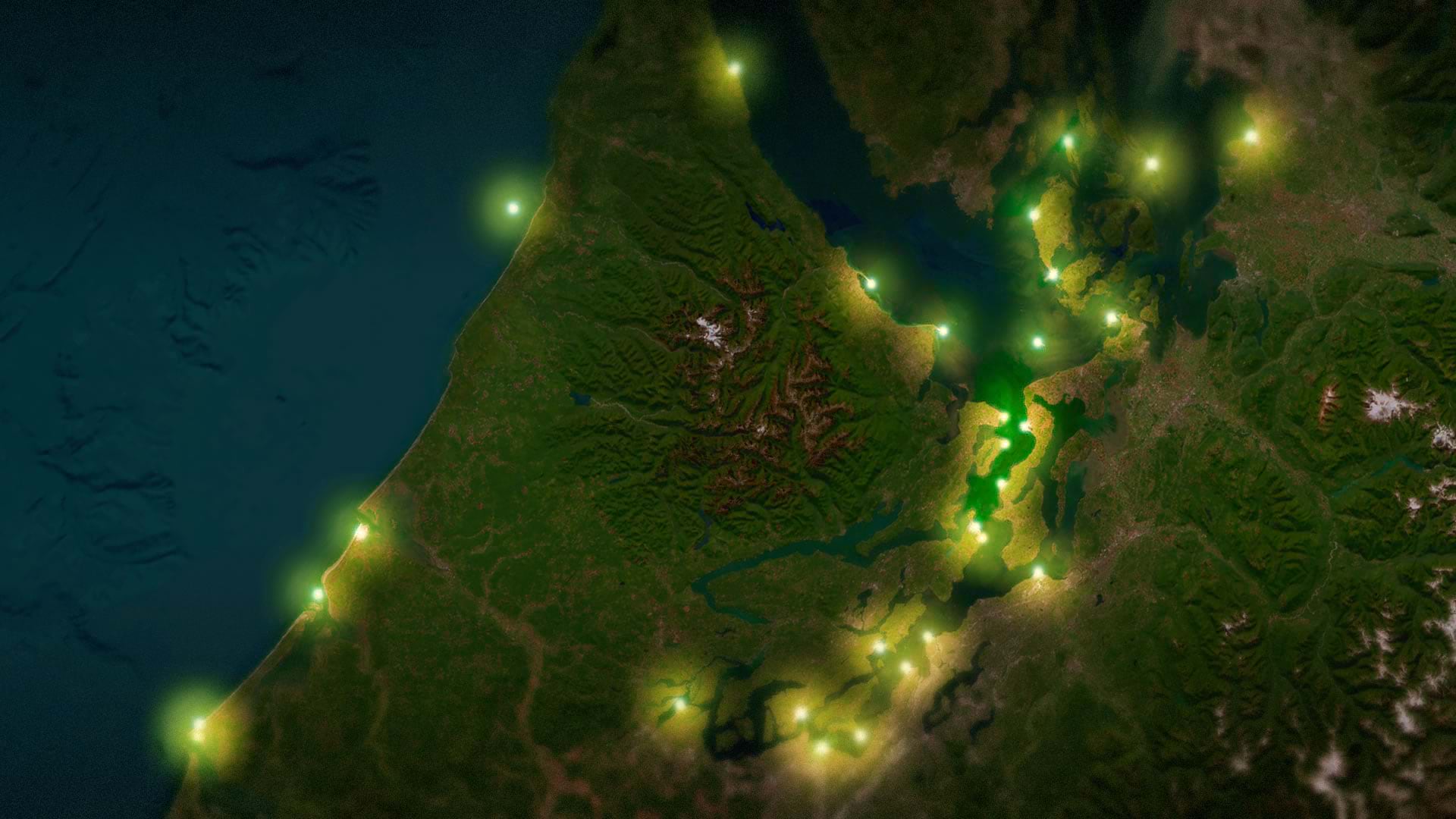 A darkened map shows glowing points along a coastal area.