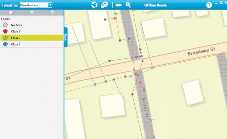 A gas utility network map that shows streets, buildings, and gas lines in different colors with red, green, blue, and white points that indicate different kinds of leaks