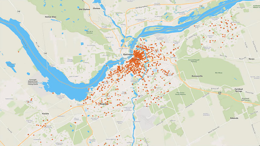 A map shows many orange circles near a river.