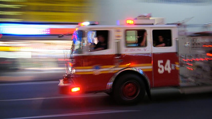 A fire truck races to a call, using the same technology a food delivery company might.