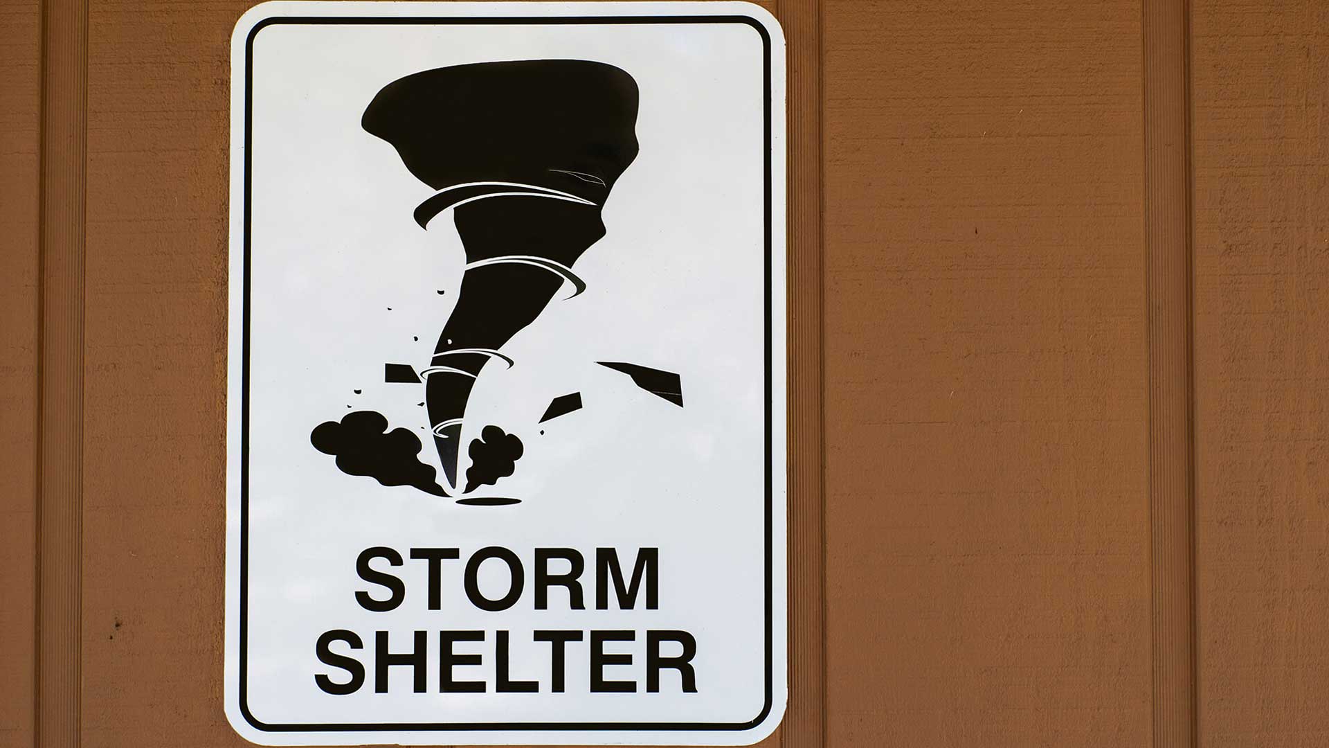 This storm shelter sign teases the idea of a climate haven