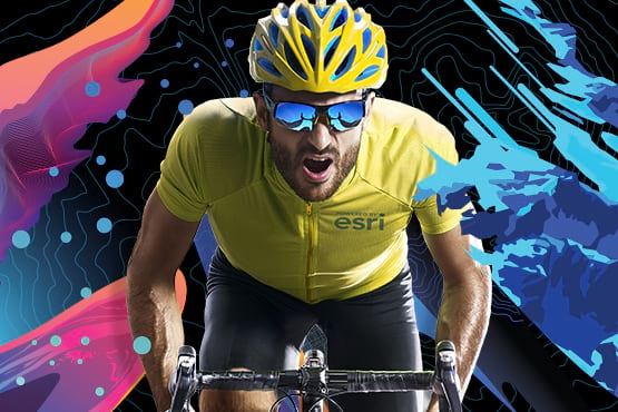 Esri UC Virtual Run/Walk/Bike 2021 cyclist wearing mirrored sunglasses and wearing a yellow jersey riding toward you