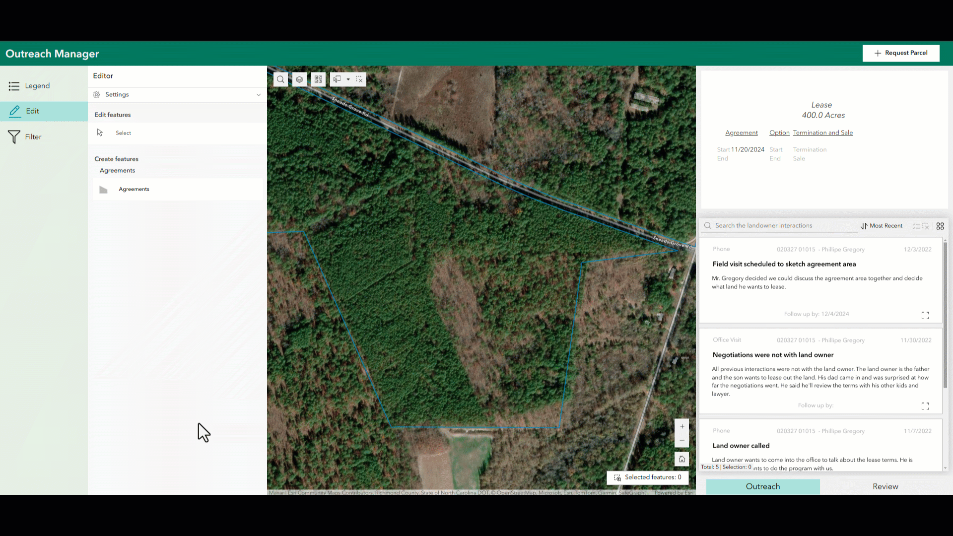 Desktop showing a parcel of land being selected and an agreement being completed.