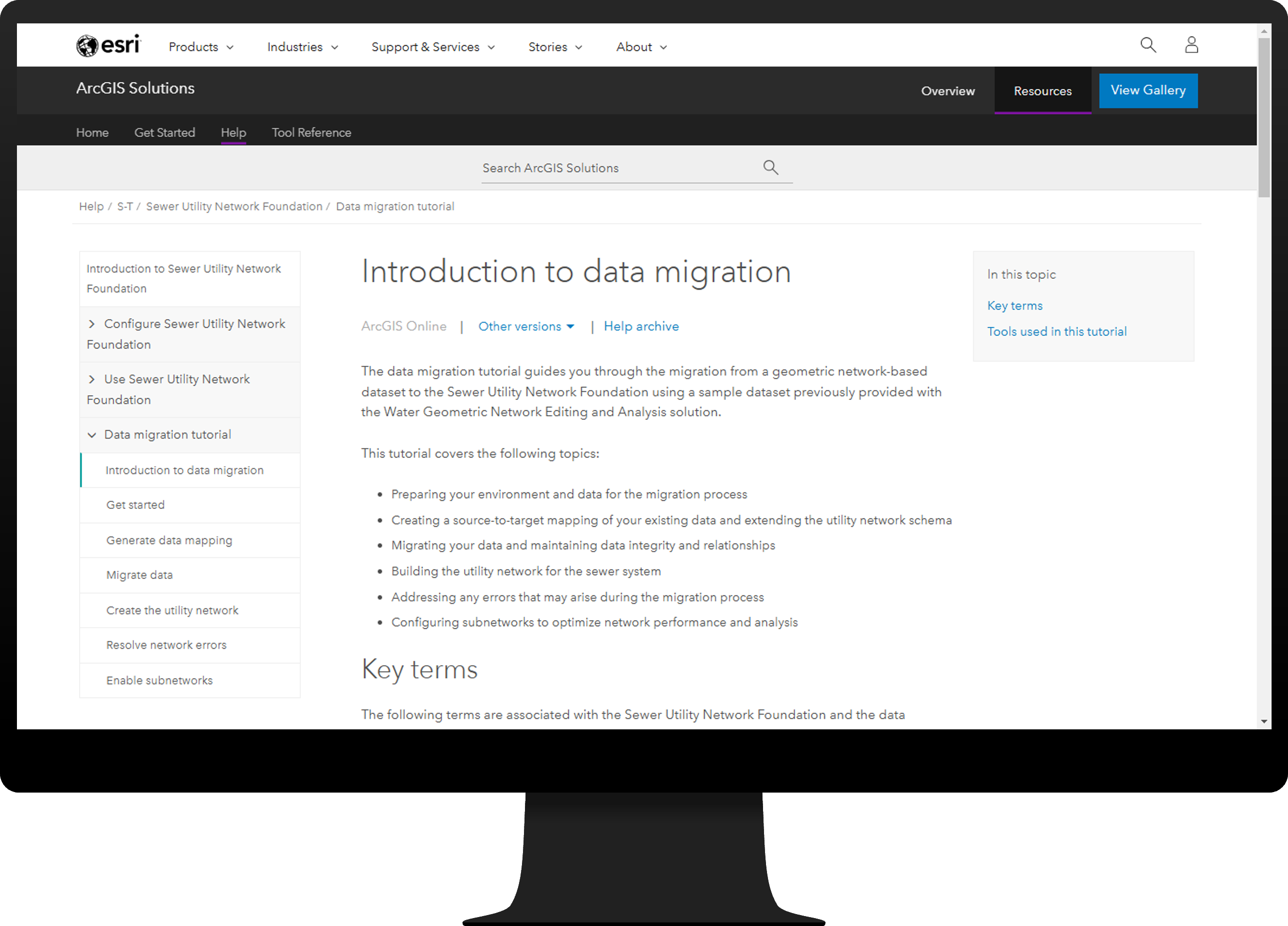 Desktop monitor showing help documentation page for the data migration tutorial.