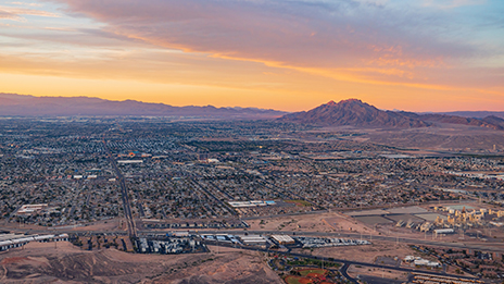 A birds-eye view of a desert city at dusk