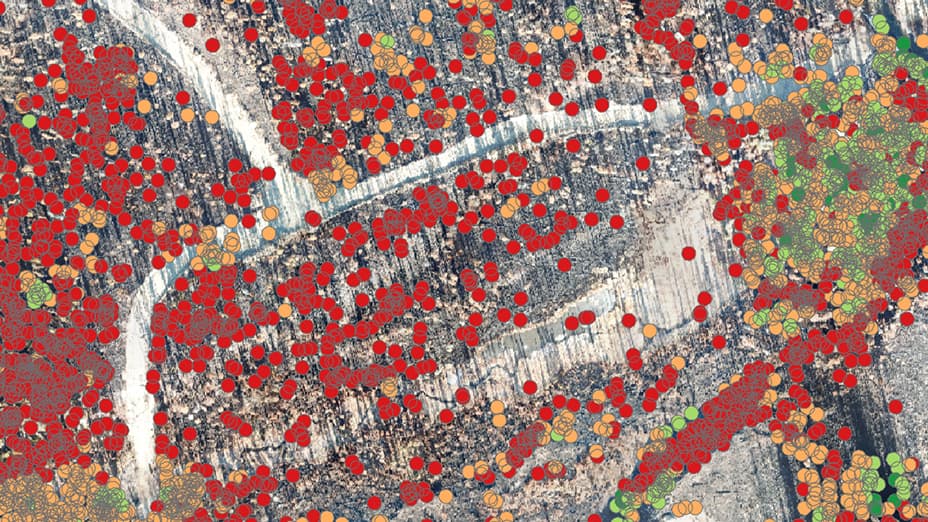 Aerial image of a city covered with red and orange dots