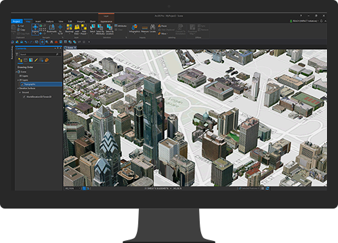 Na monitorze komputerowym wyświetlana jest wygenerowana komputerowo mapa 3D miasta