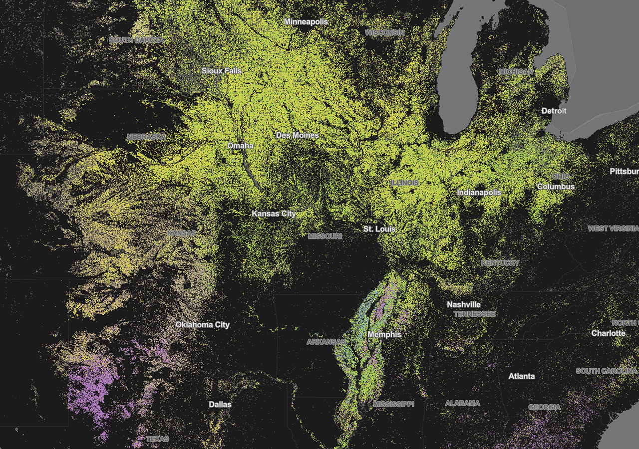 Una mappa di contorno degli Stati Uniti centrali in verde lime e viola su uno sfondo nero