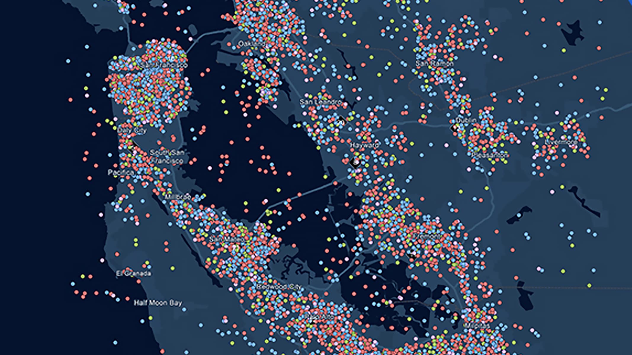  A concentration map in shades of navy blue scattered with colorful map points