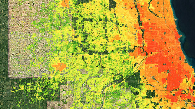 A map of a coastal city shows red hot spots downtown, fading to orange, yellow, and green in nearby suburbs and rural areas