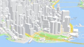 Mapa 3D de Manhattan com edifícios cinzentos, estradas amarelas e água azul usando API de serviço de mapas base