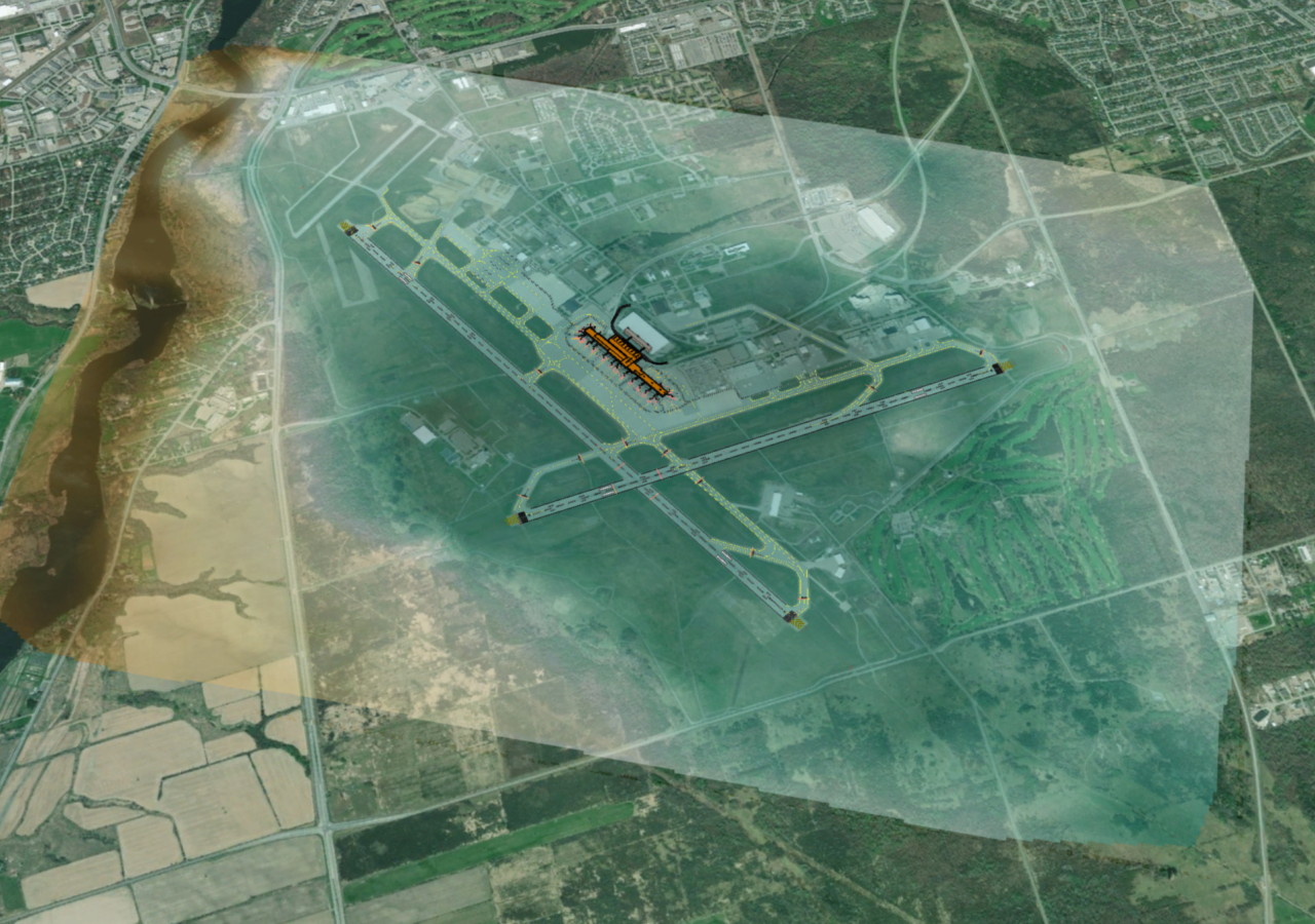 Vista aérea del mapa de un aeropuerto con zonas resaltadas en verde, aviones y un aeropuerto en naranja