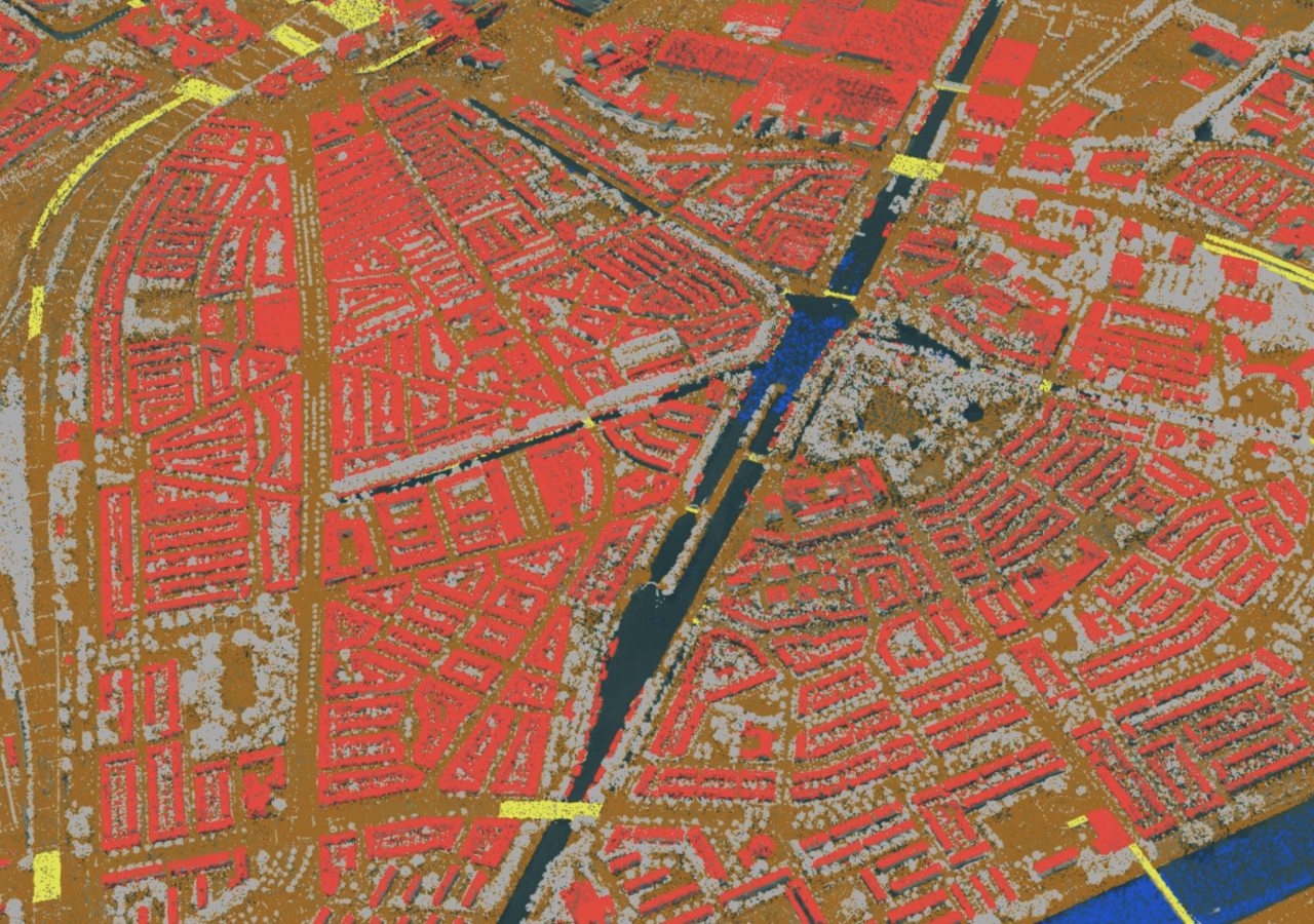 Aerial view of a city map with buildings colored bright red and roadways colored brown