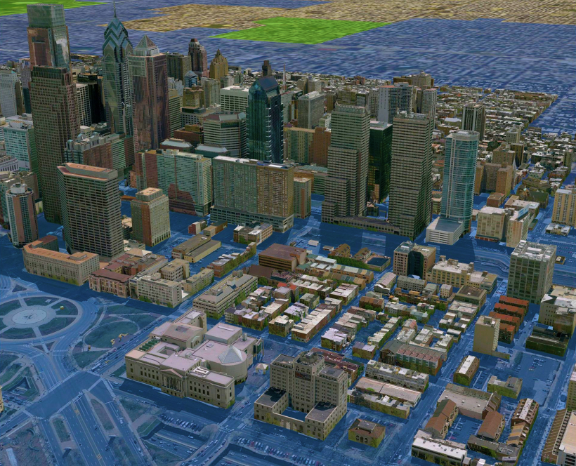 3D model of downtown in a large city with the ground all blue and realistically colored 3D buildings