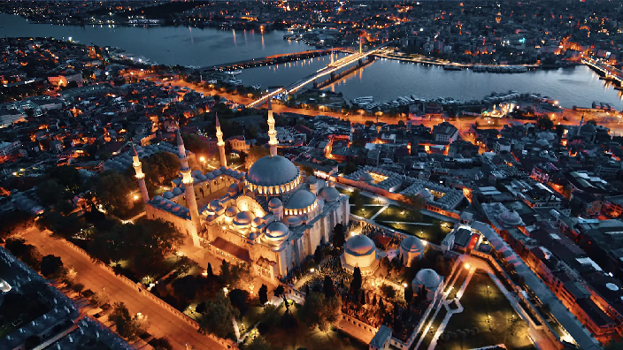 Aerial image of a Turkish city brightly lit for nighttime
