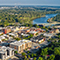 An aerial view of a mid-sized city near a river 