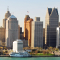 A city skyline with a channel of water in the foreground