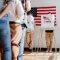 People standing in line to vote at a voting center 