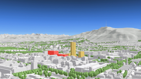 Modelo 3D de una ciudad con edificios grises, una montaña y árboles verdes proyectados con un sistema de coordenadas local