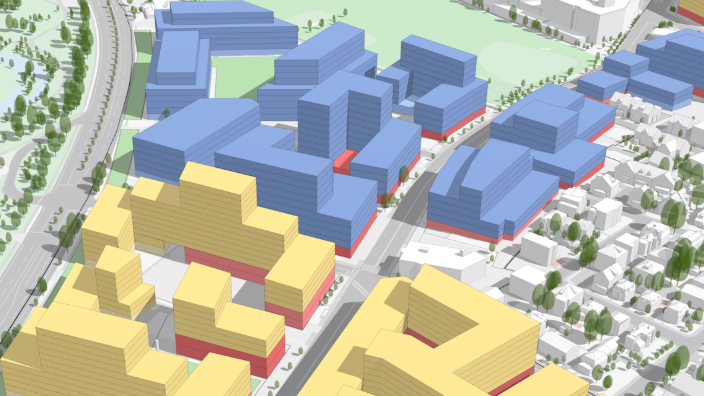 Un modello 3D dello sviluppo pianificato in una città con edifici selezionati colorati in giallo e verde