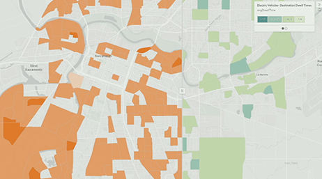 A map of a region with parts shaded in orange and green overlaid with a play button