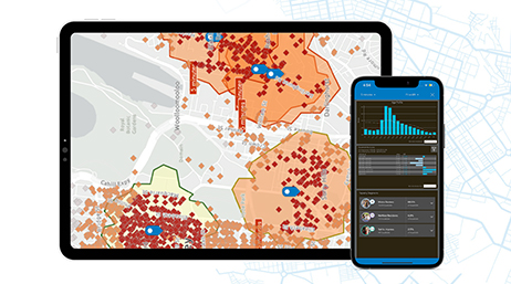 A tablet screen displaying a map with red dots and orange regions and a mobile device displaying infographics 