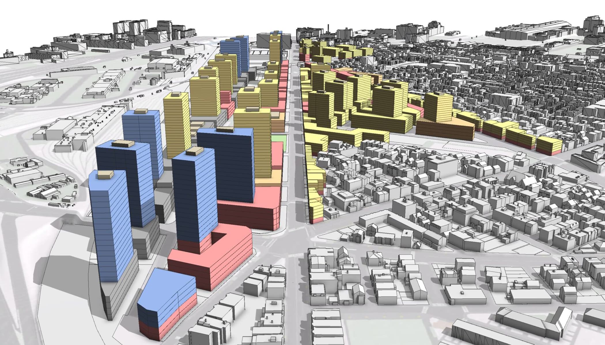 Aerial view of a city block with multicolored shapes in blue, yellow, and red representing buildings and streets