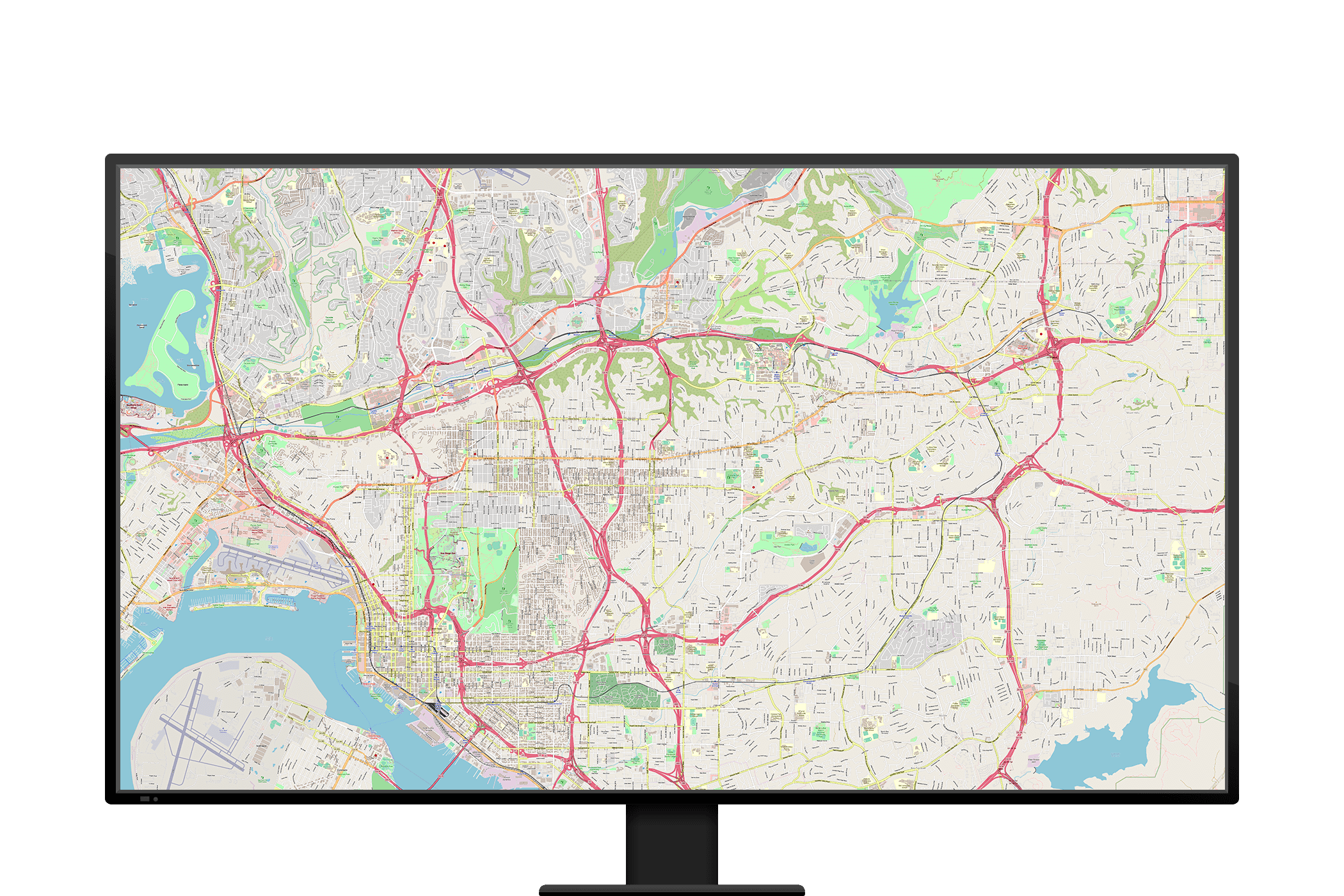 A computer monitor displays a detailed street map of San Diego, California, with road names and routes highlighted in red