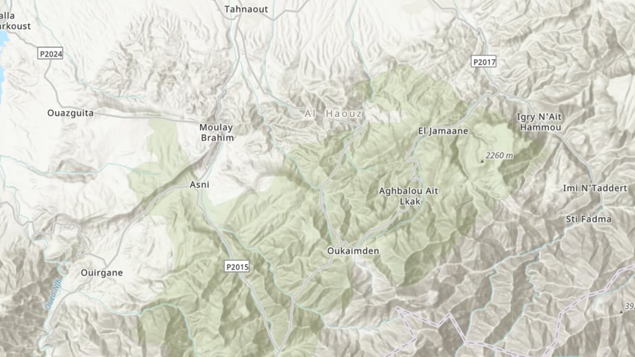 Topographic map with light green and tan contours, narrow roads, and place names in black text