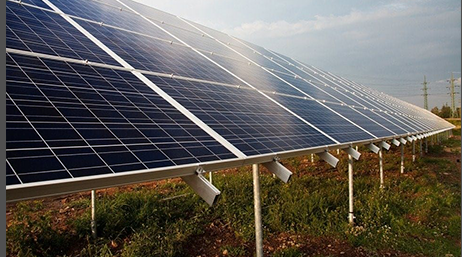 Large square solar panels in a field