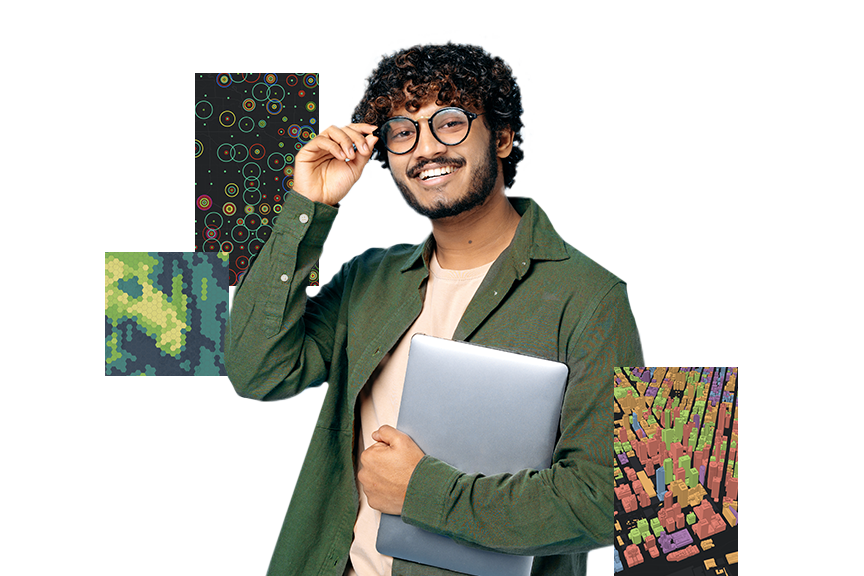 Молодой человек в очках и зеленой рубашке держит в руках серебристый ноутбук