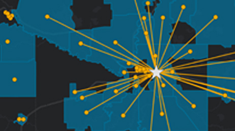 A map with regions shaded in dark gray and blue with a burst connecting data points to a central location