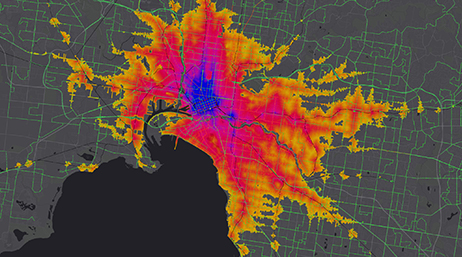 A yellow, pink, and blue heat map of a sprawling city in gray and green