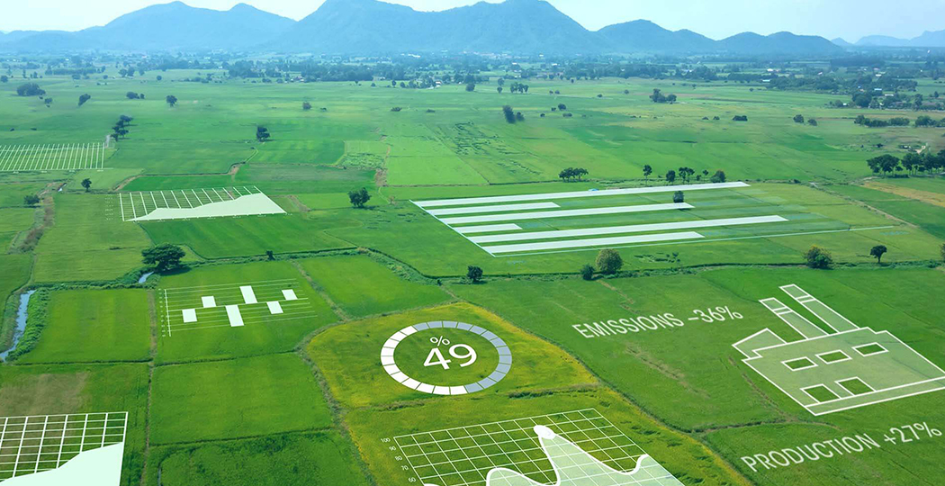 Aerial image of a sprawling green tree-dotted pasture, overlaid with a layer of related charts and icons