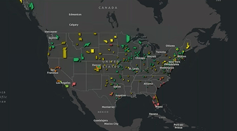 A map of the United States in dark mode with different counties highlighted in various colors overlaid with a play button