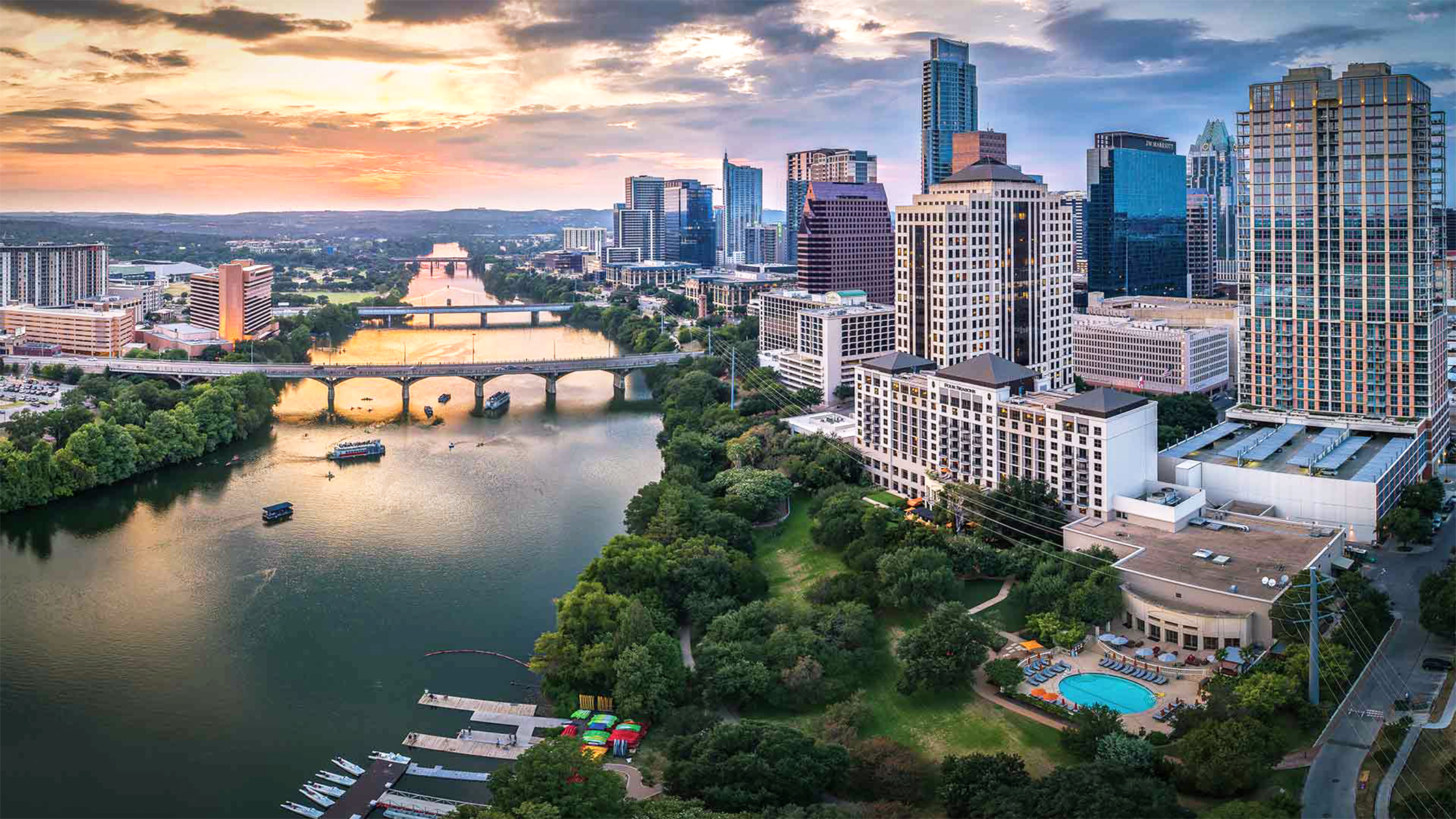 Aerial view of the Austin, Texas skyline at sunset.