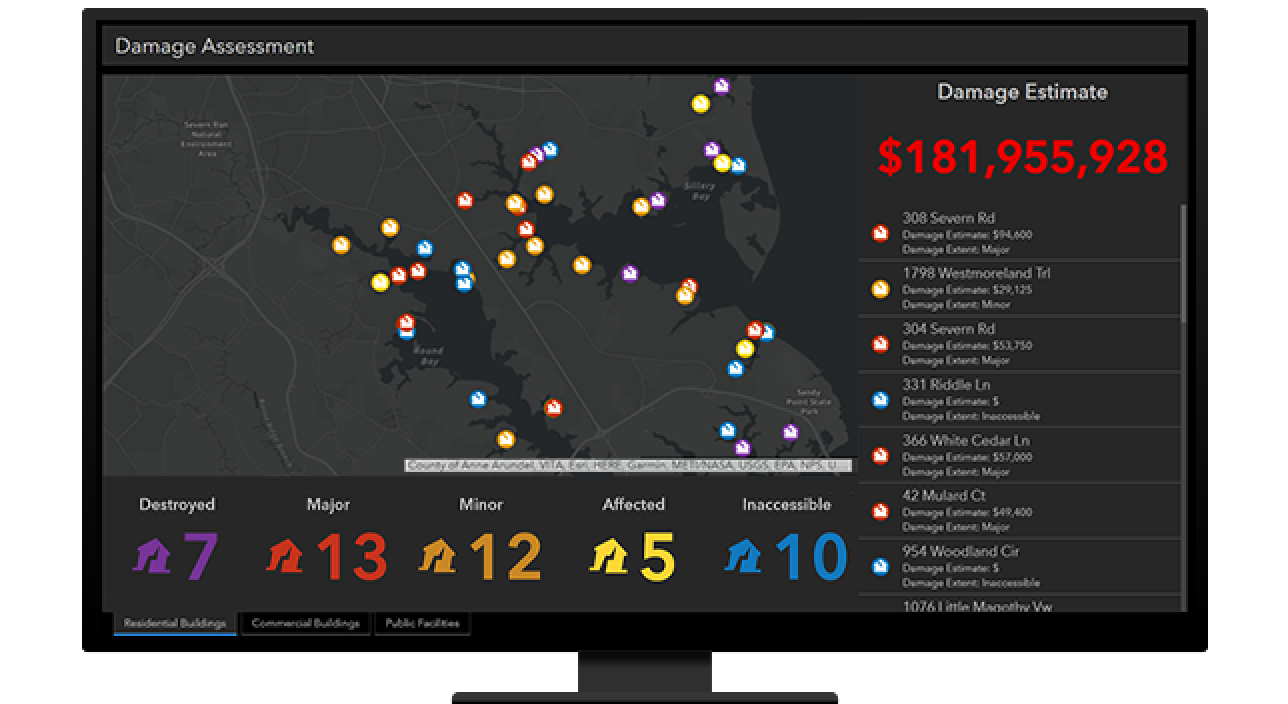 A computer monitor displaying a map dashboard with colorful map points on a dark gray map alongside several lists of data