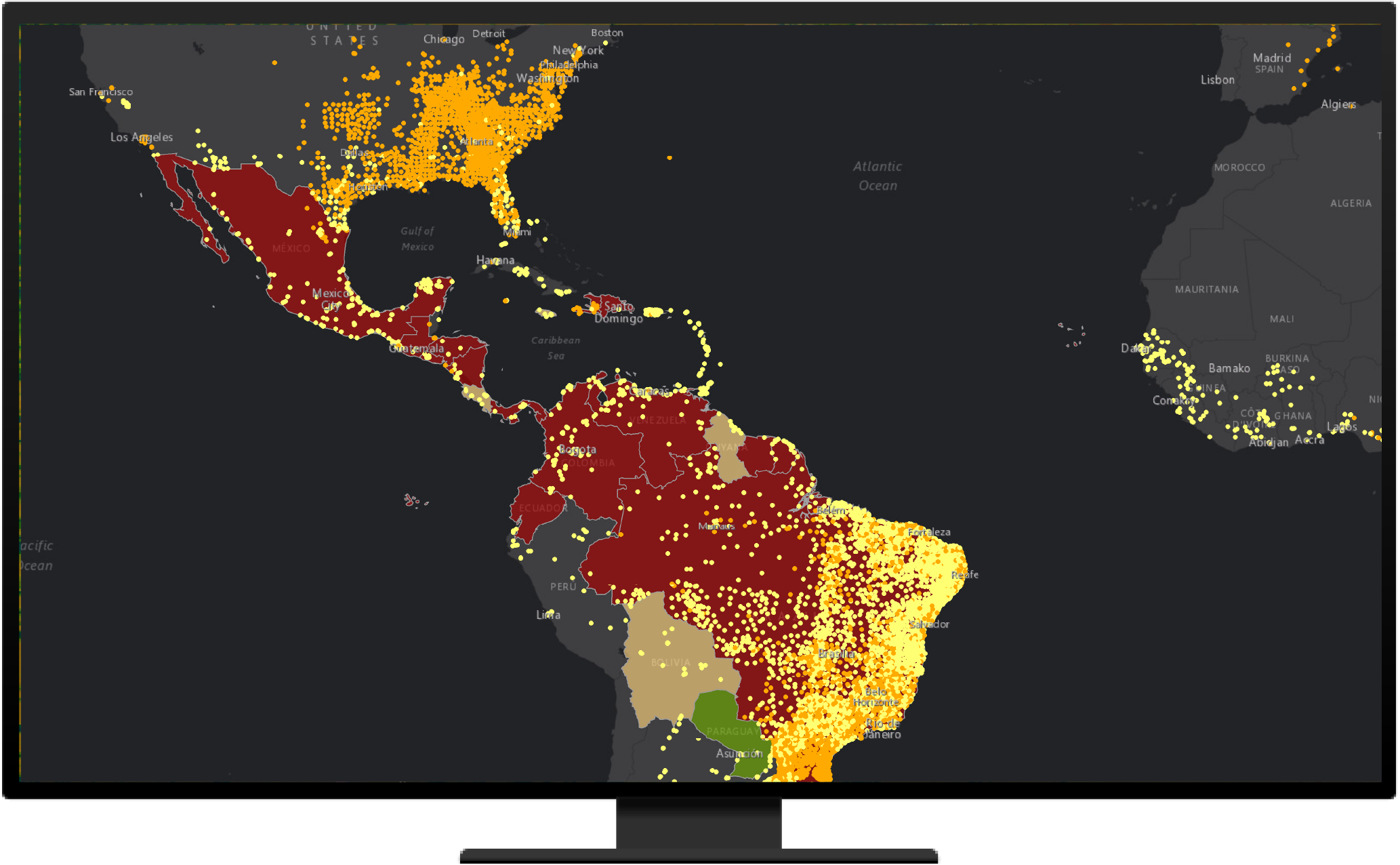 A map of parts of North and South America and Africa shaded in red, yellow, and green