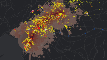 Um mapa com muitos pontos de dados amarelos e vermelhos agrupados sobrepostos em uma região sombreada em vermelho claro