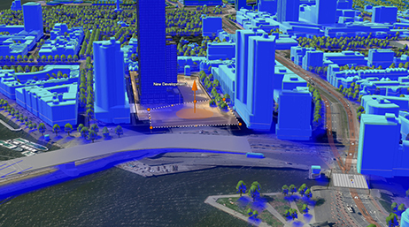 A digital 3D model of a downtown area near a body of water with buildings shade in blue 