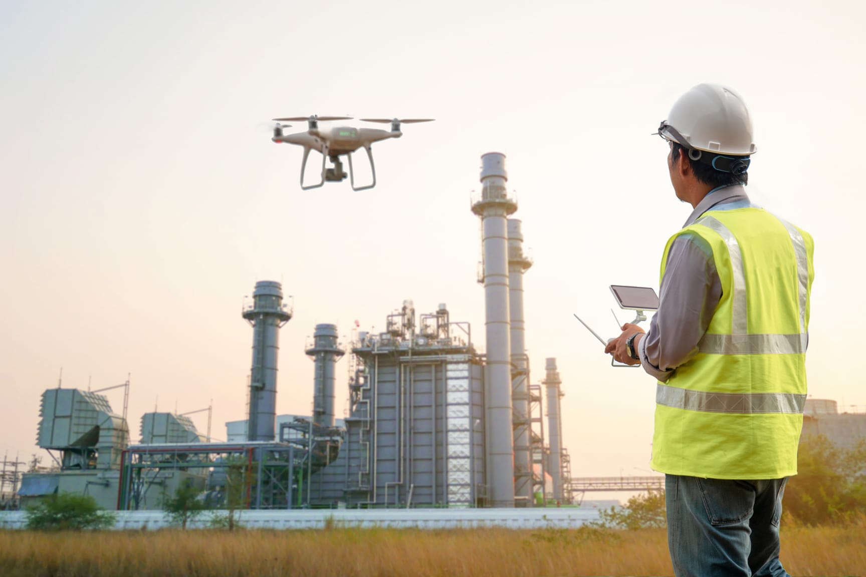 Drone inspection. Operator inspecting construction building turbine power plant