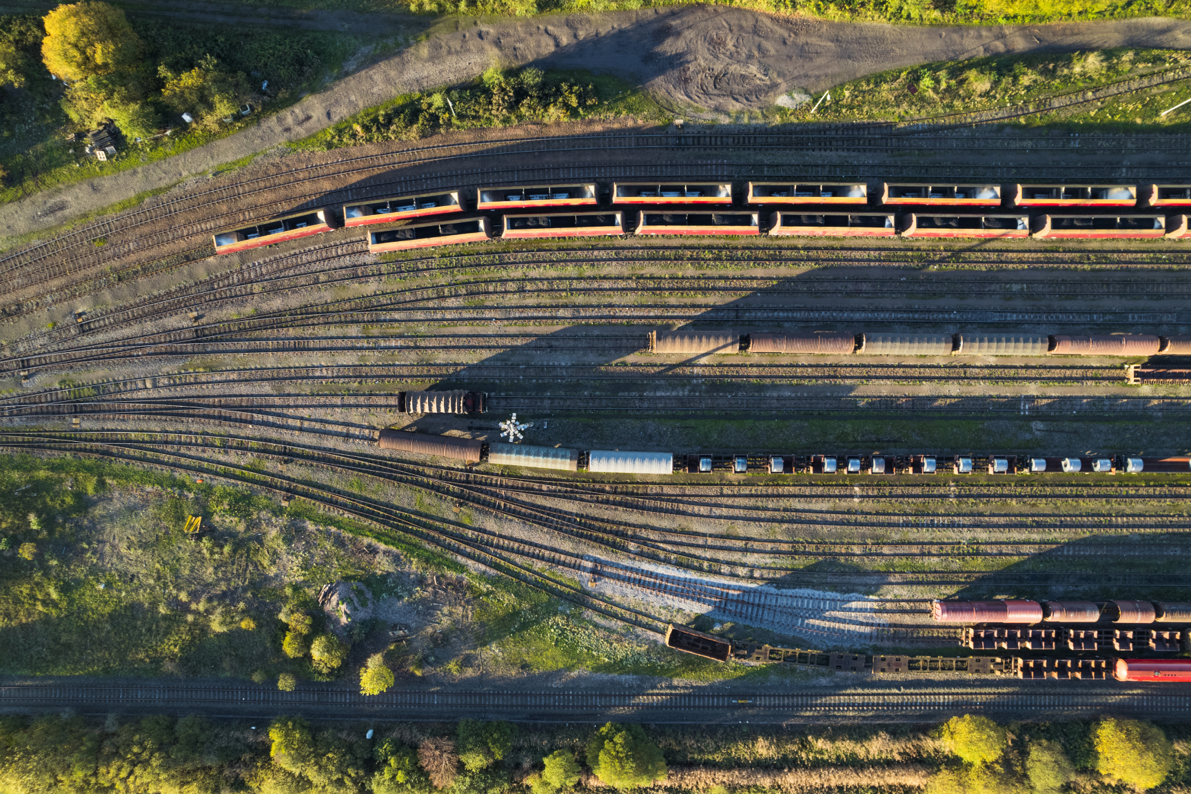 Aerial shot of freight yard with train carriages 