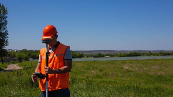 Surveyor with gps on construction site