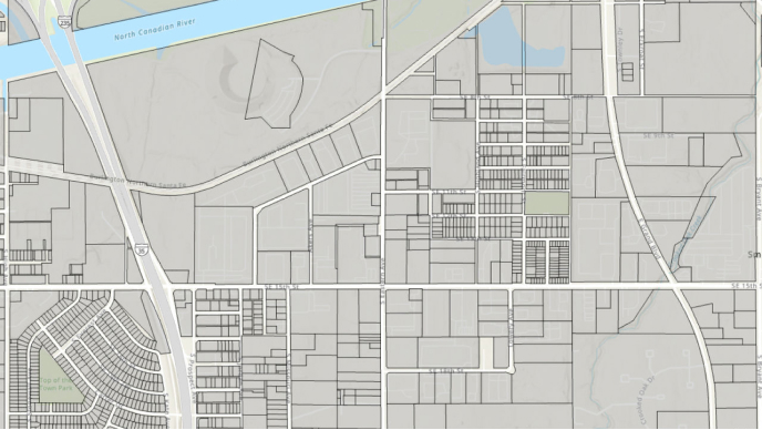 A city map with a river flowing through it, showcasing the urban layout and waterway.